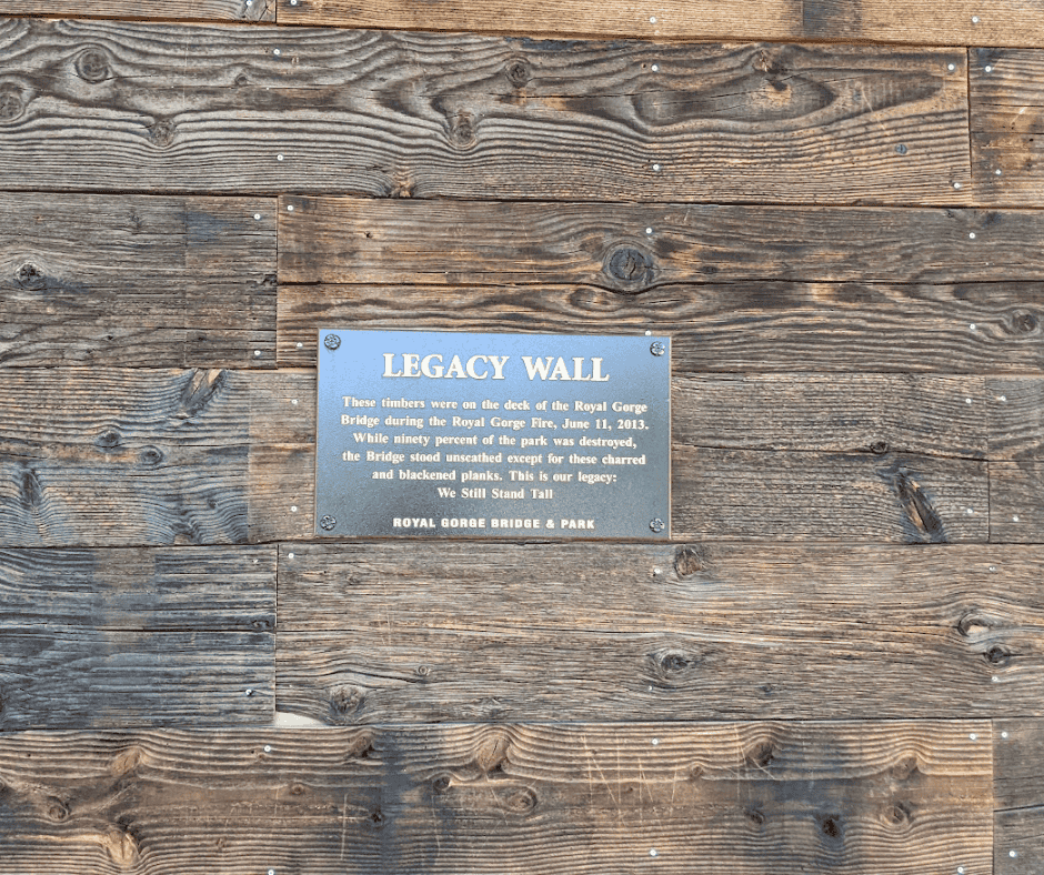 Legacy Wall made from bridge surface planks that burned in the 2013 wildlife.